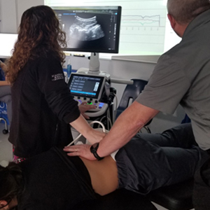 picture Millville chiropractic ultrasound imaging of spinal vertebrae during treatment
